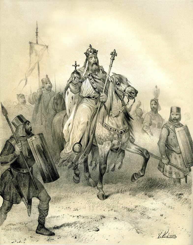 Cesarz Karol Wielki, noszący emblematy władzy, jedzie na czele swoich żołnierzy w zbrojach. Rycina autorstwa Victora Adama (1801-1866) w książce "Francja w średniowieczu" wydanej przez braci Ardant w połowie XIX wieku. autorstwa Victor Adam