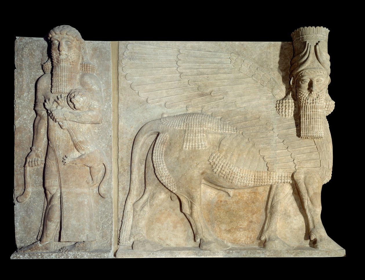 Sztuka Mezopotamia (Asyria): dziedziniec pałacu króla Asyrii Sargona II (721-705 pne): skrzydło byka androcefal z bohaterami opanowującymi lwa. Paryż, Musee du Louvre autorstwa Assyrian