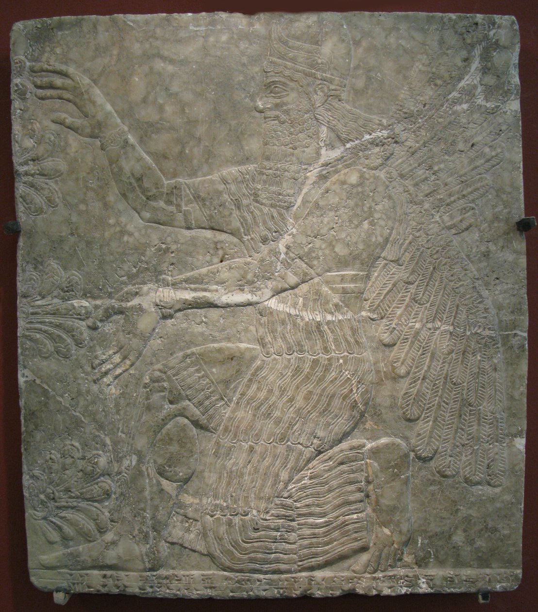 Skrzydlate bóstwo przy świętym drzewie. Płaskorzeźba z pałacu Aszurnasirpala II w Kalhu, Nimrud, IX wiek p.n.e. autorstwa Assyrian