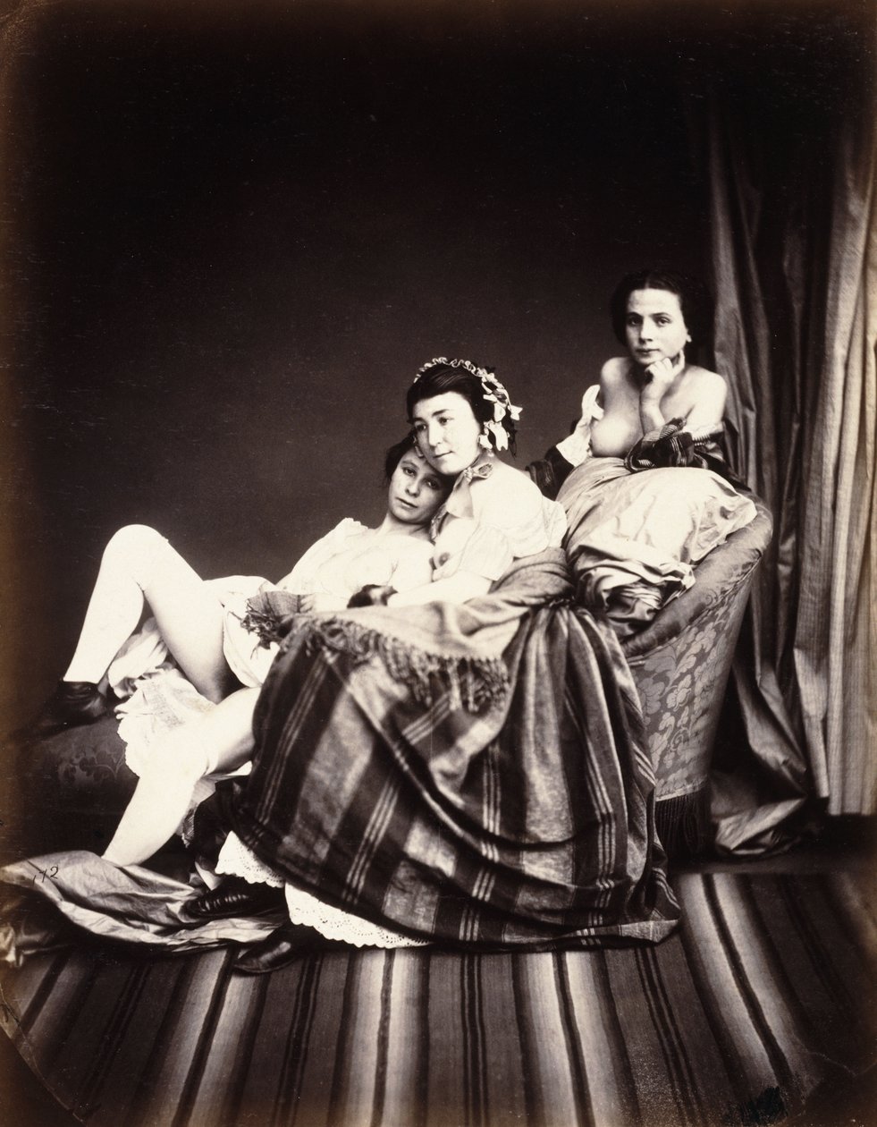 Trzy nagie kobiety na szezlongu, ok. 1850 autorstwa Auguste Belloc