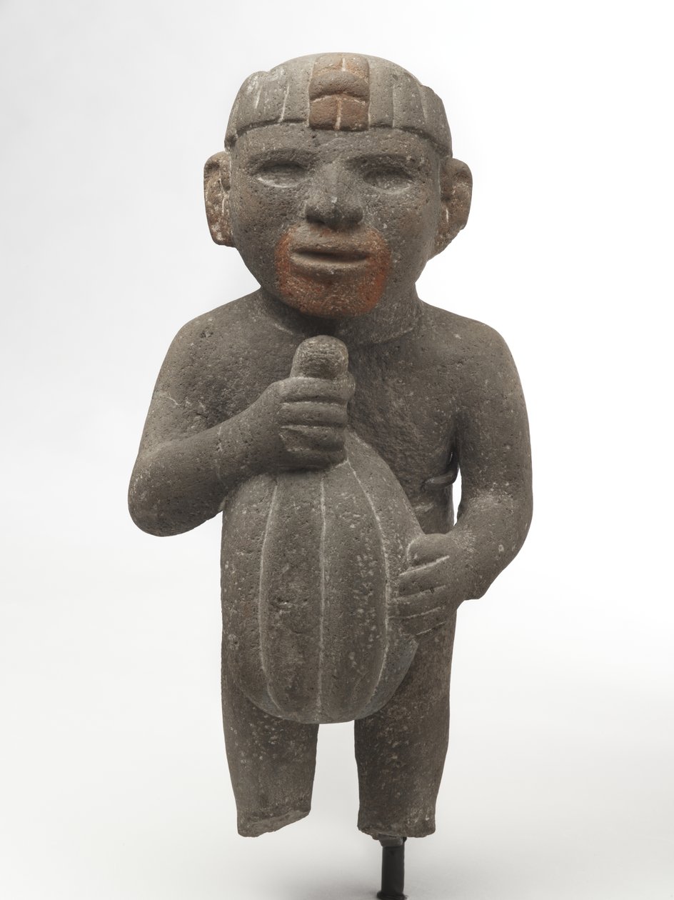 Mężczyzna niosący strąk kakao, 1440-1521 (kamień wulkaniczny ze śladami czerwonego pigmentu) autorstwa Aztec