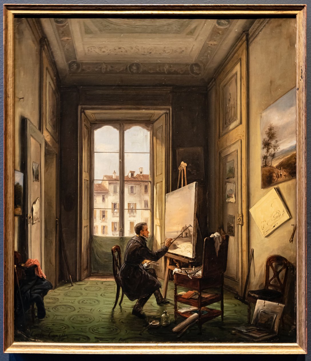 Portret malarza Giuseppe Canelli w jego pracowni w Mediolanie autorstwa Carlo Canella