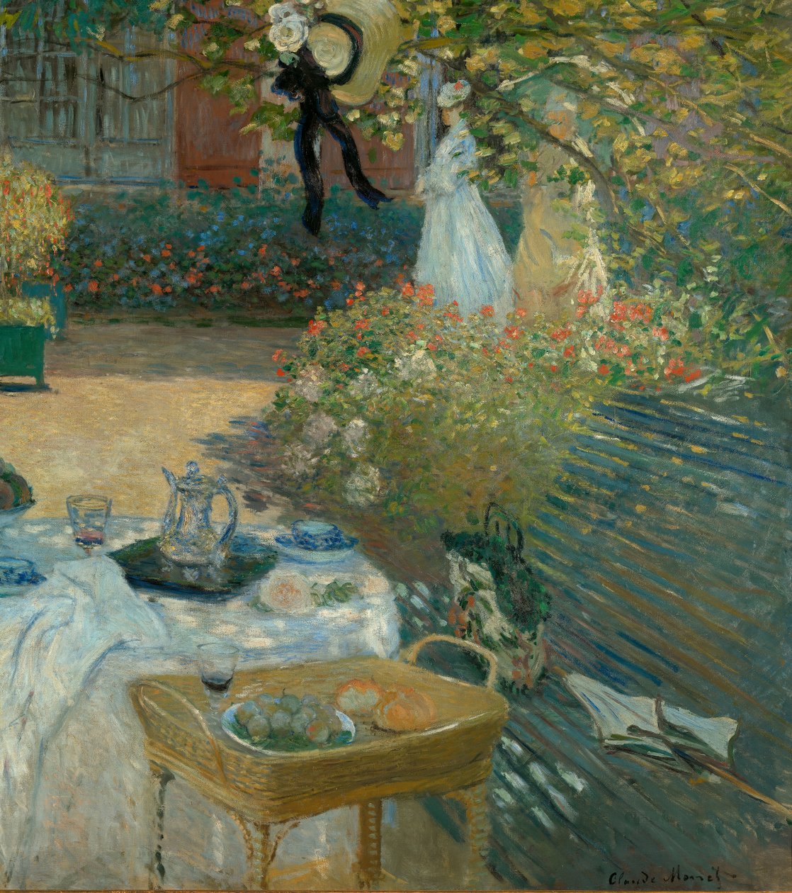 Lunch w ogrodzie Moneta w Argenteuil autorstwa Claude Monet