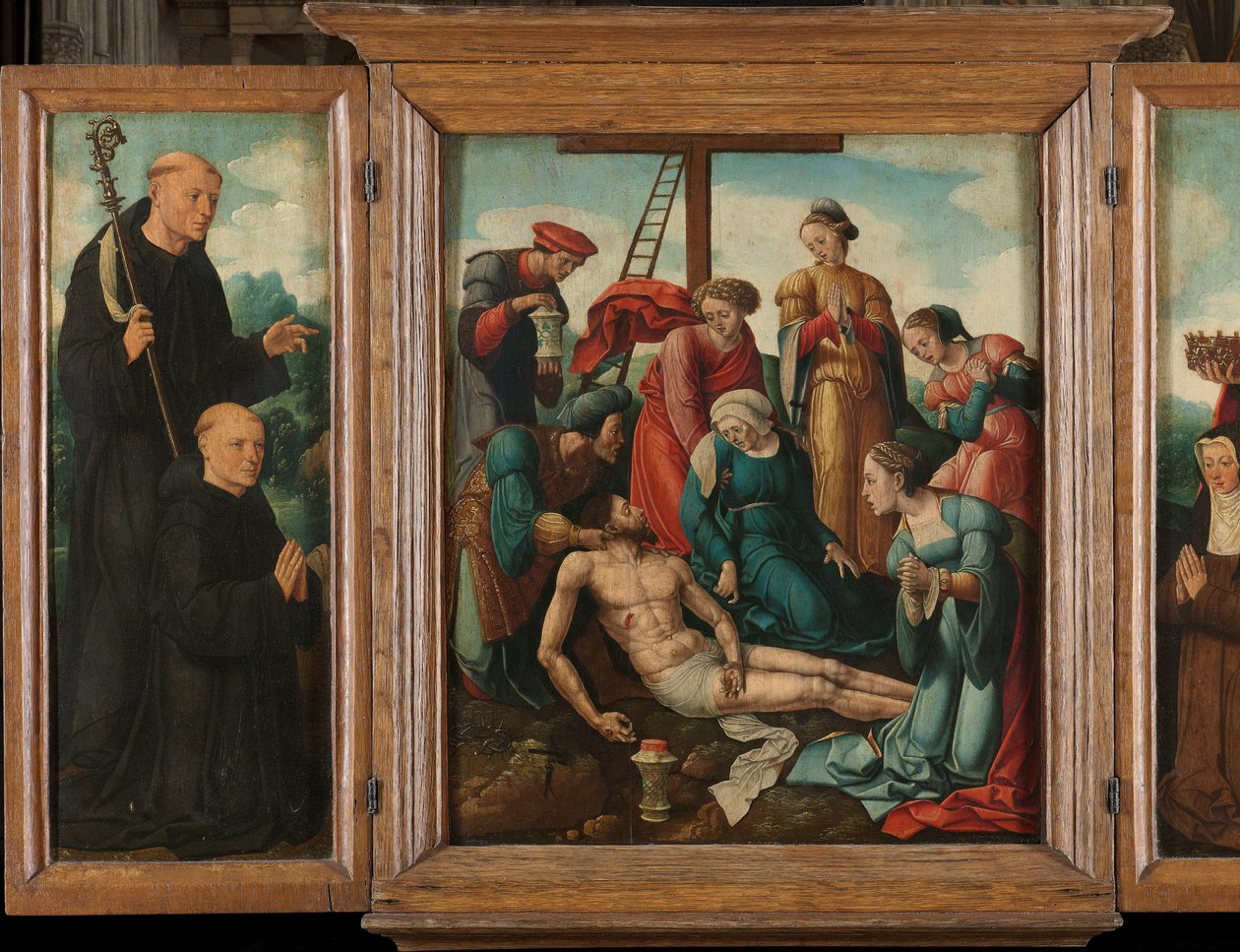 Tryptyk z Opłakiwaniem Chrystusa (w środku), flankowany przez ofiarodawcę męskiego ze św. Benedyktem (lewe, wewnętrzne skrzydło) i ofiarowczynię ze św. Elżbietą Turyngii (prawe, wewnętrzne skrzydło) autorstwa Cornelis Cornelisz II Buys (attributed to)