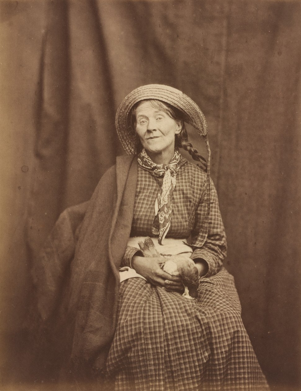 Kobieta trzymająca martwego ptaka, azyl hrabstwa Surrey, ok. 1930 r. 1855. autorstwa Dr Hugh Welch Diamond