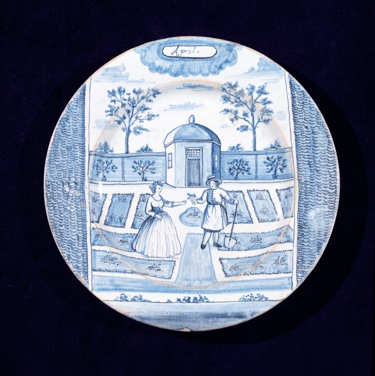 Tabliczka Delftware przedstawiająca miesiąc kwiecień (ceramika glazurowana cyną) autorstwa Dutch School