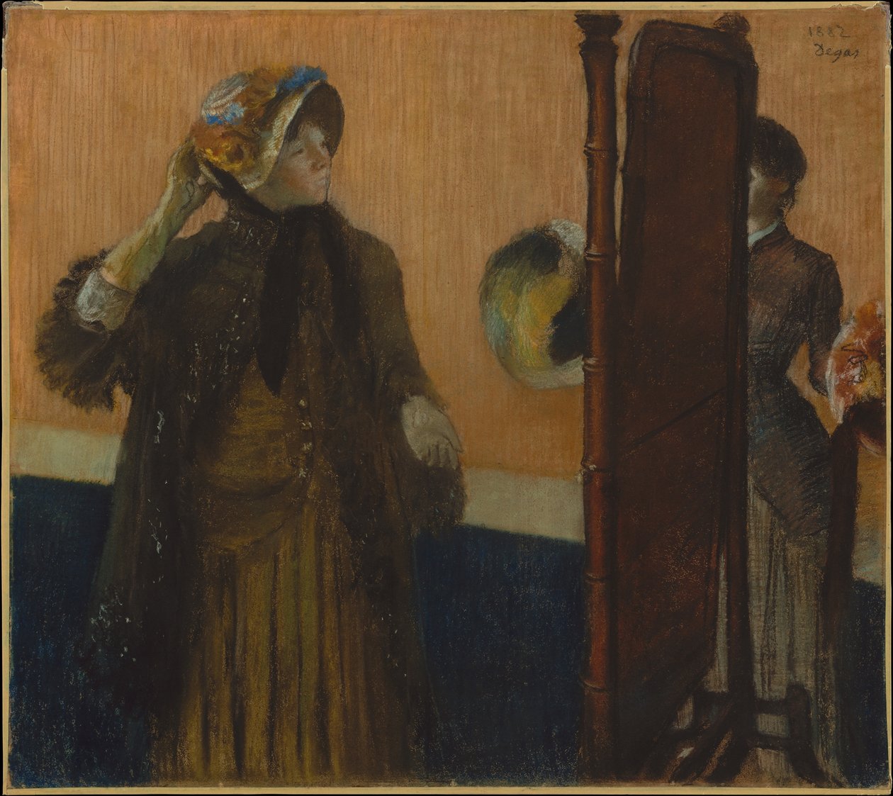 U modystki autorstwa Edgar Degas