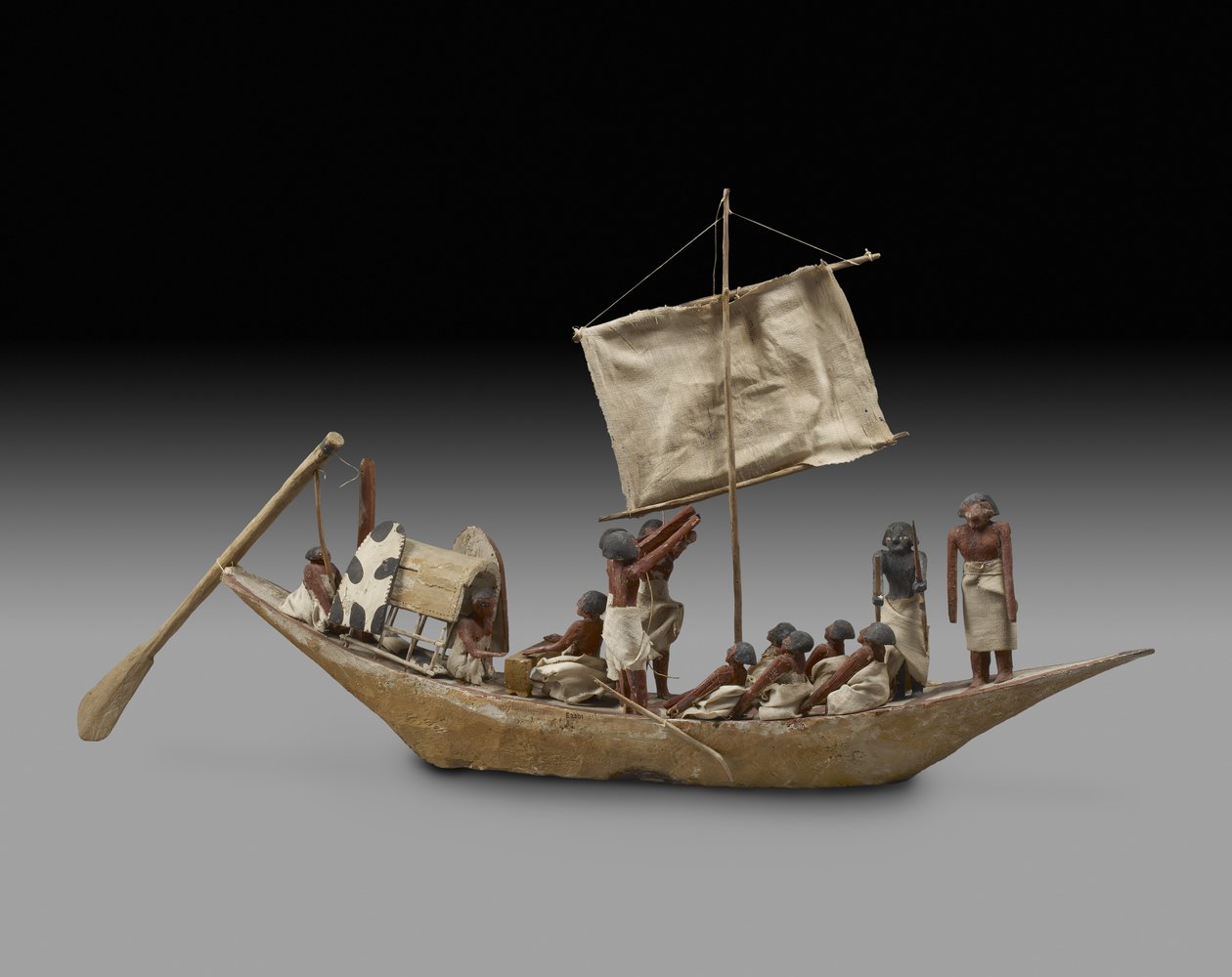 Model łodzi wojennej z żaglem, wiosłami i 14 figurami, dynastia 9-11 (ok. 2125-1940) (drewno, zaprawa, tekstylia, farby, len i sznurek) autorstwa Egyptian