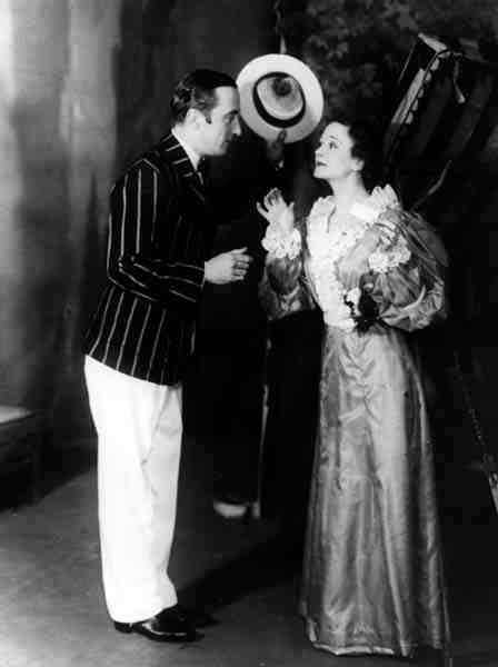 George Curzon jako Algernon Moncrieffe (Algy) i Ursula Jeans jako Cecily Cardew, w The Znaczenie of Being Earnest, Oscar Wilde (1854-1900) w Old Vic Theatre, 5 lutego 1934 (zdjęcie czarno-białe) autorstwa English Photographer