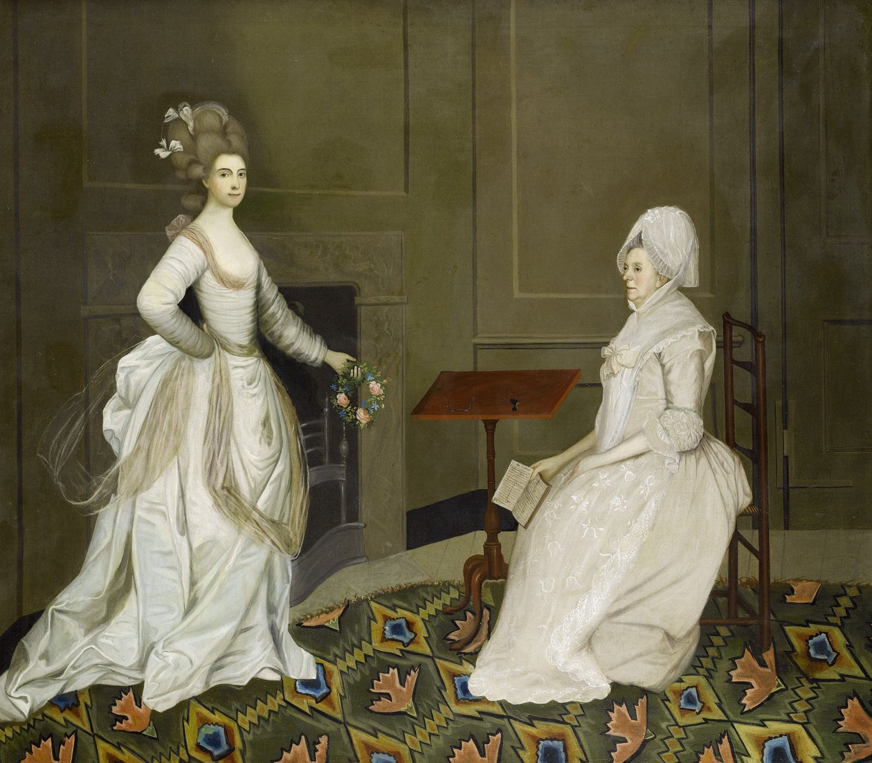 We wnętrzu dwie panie, jedna czytająca, druga trzymająca girlandę kwiatów autorstwa English School, 18th Century