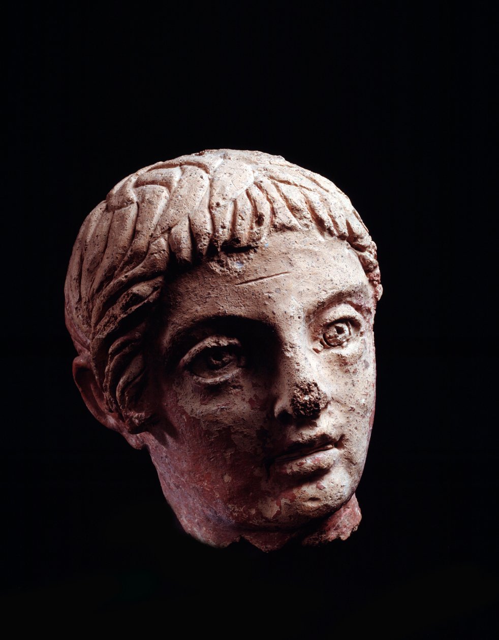 Cywilizacja etruska: głowa młodzieńca ze świątyni Belvedere, w Orvieto - V-IV wpne Średnica 13 cm autorstwa Etruscan