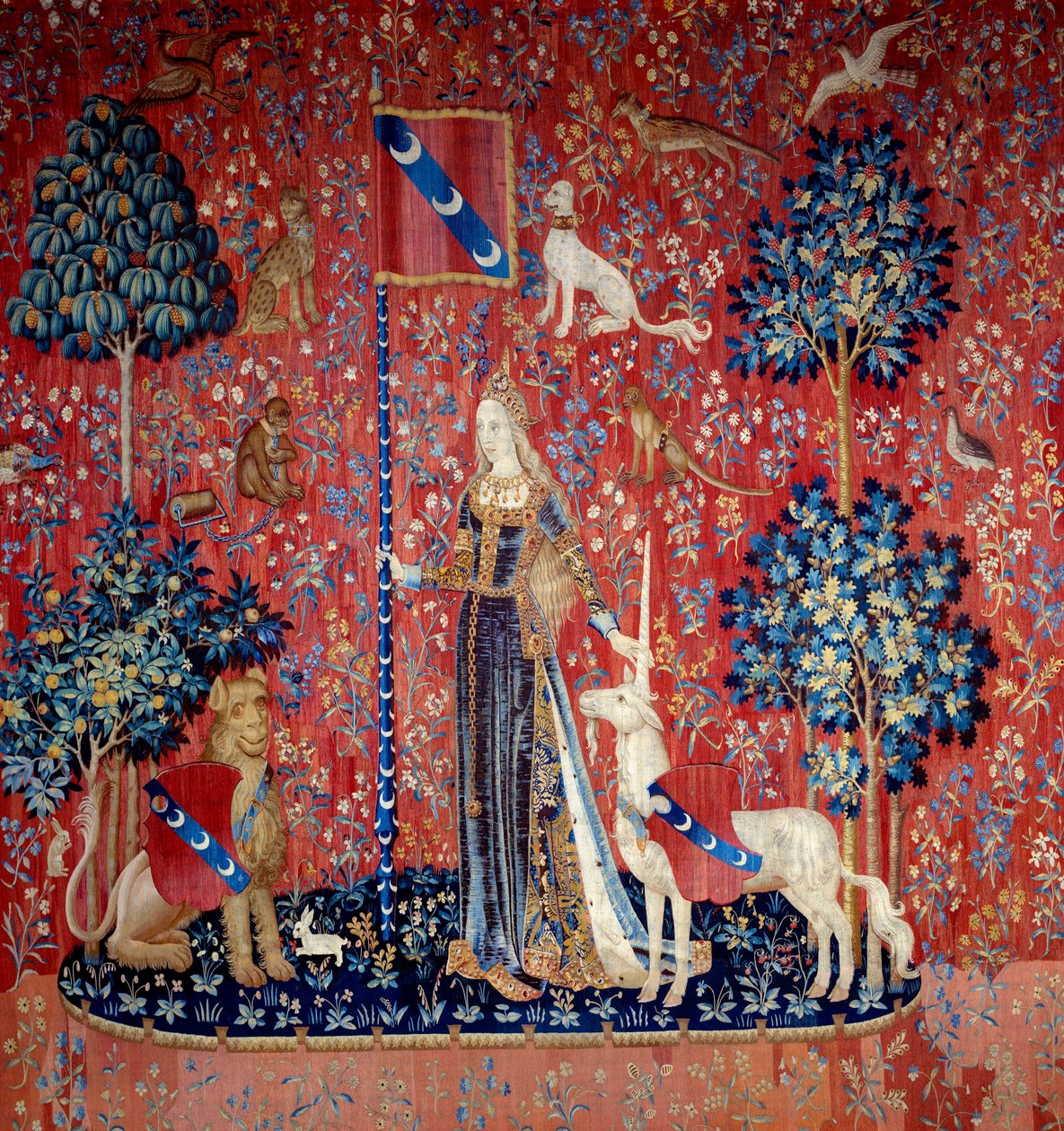 Młoda kobieta w otoczeniu lwa, jednorożca, małpy i królików - Wełniany i jedwabny gobelin wykonany w latach 1484-1500, z zamku Boussac w Creuse. Słońce. 3,7x4,7 m - Paris, musee national du Moyen Ages, Thermes de Cluny - Alegoria dotyku (Le Touch autorstwa Flemish School