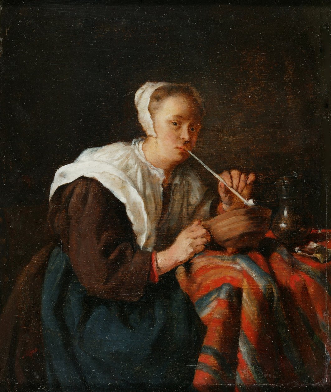 Kobieta siedząca i paląca fajkę (olej na desce) autorstwa Gabriel (after) Metsu