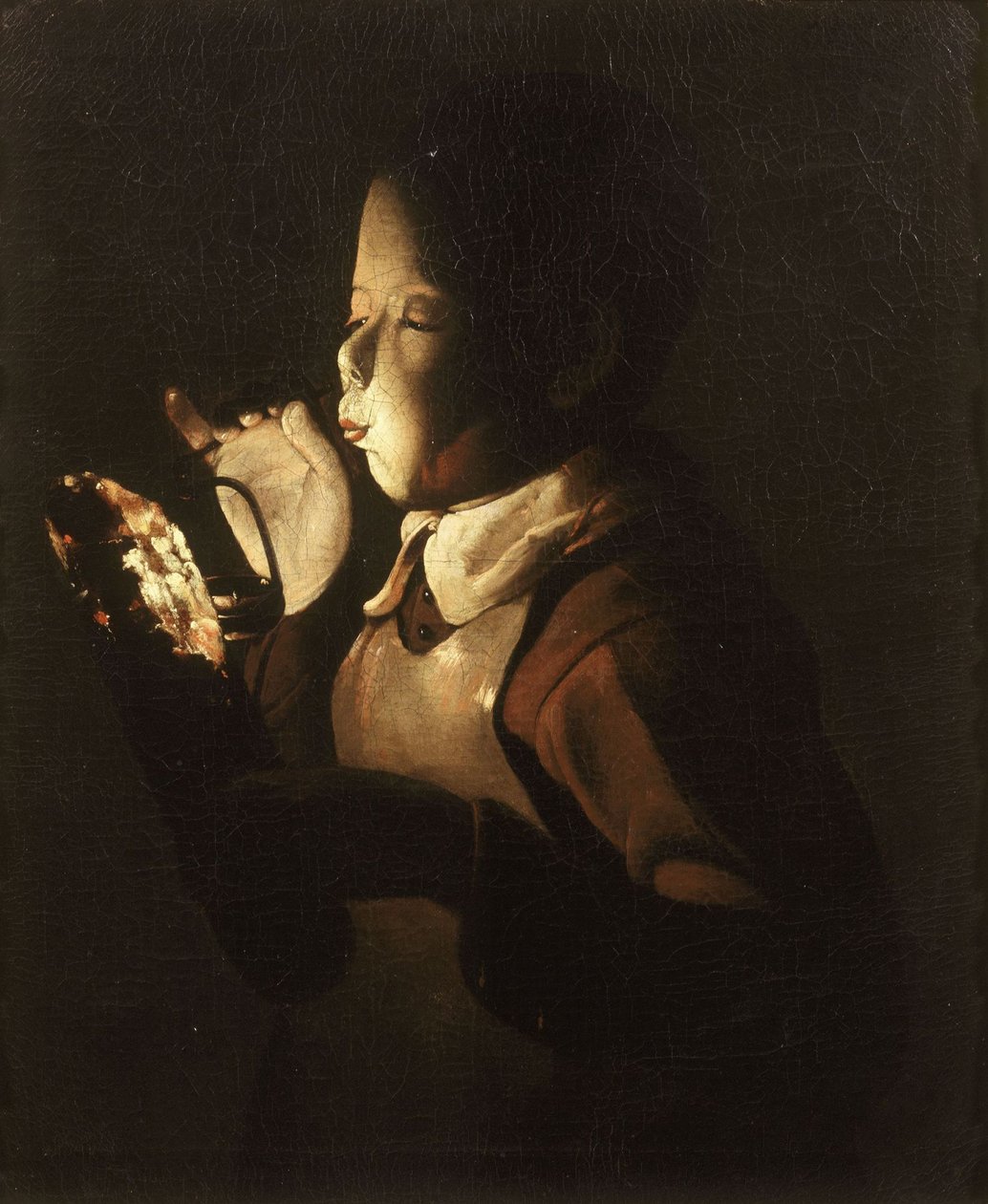 Chłopiec dmuchający w lampę autorstwa Georges de La Tour