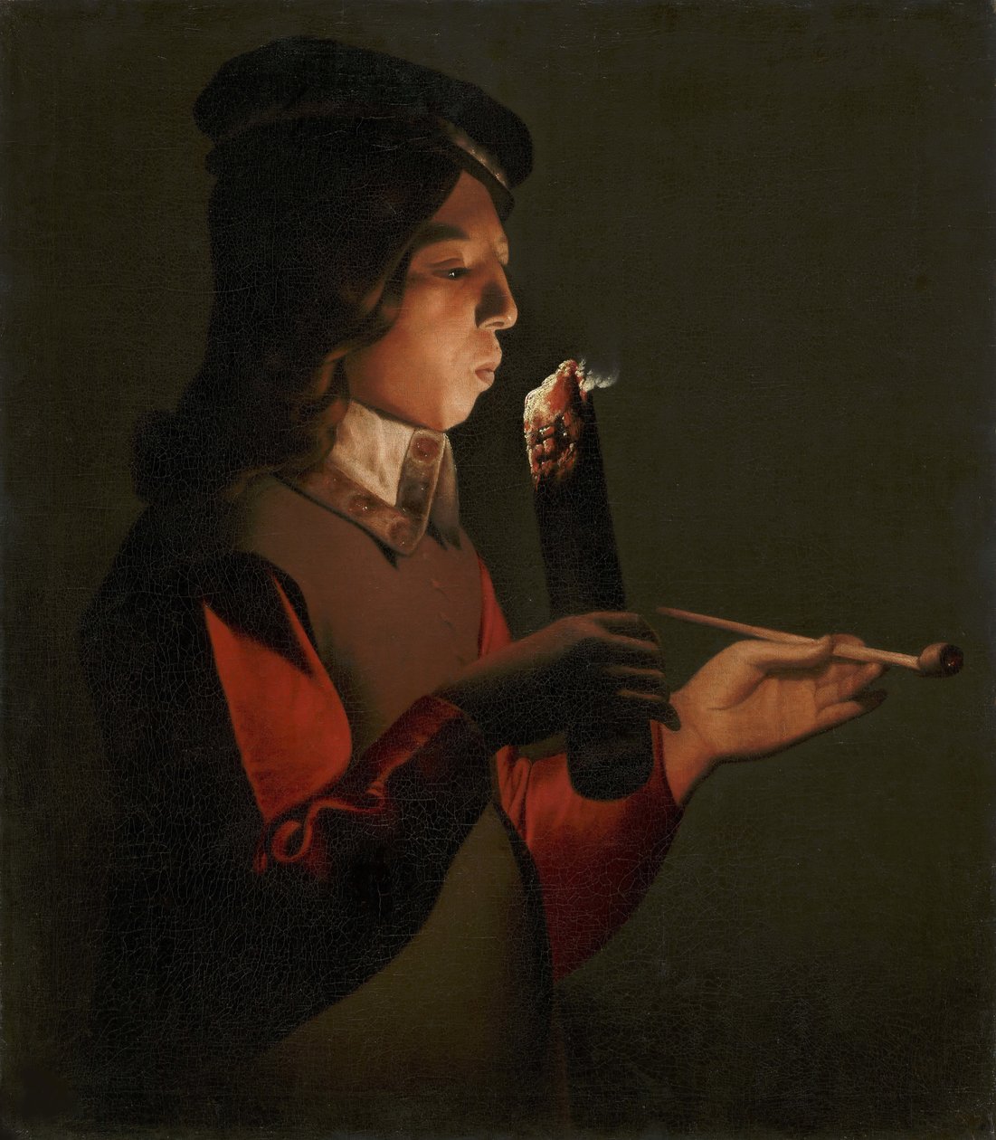Młody chłopak z fajką, dmuchający na podpałkę, autorstwa La Tour, Georges, de (1583-1652). olej na płótnie autorstwa Georges de La Tour