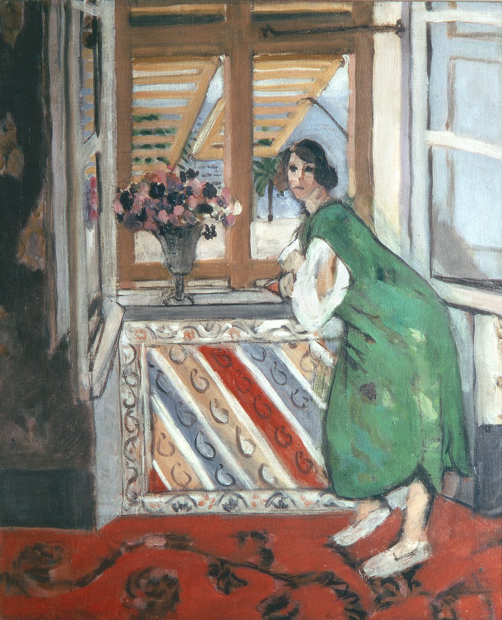 Wnętrze w Nicei: Młoda kobieta w zielonej sukience oparta o okno autorstwa Henri Matisse