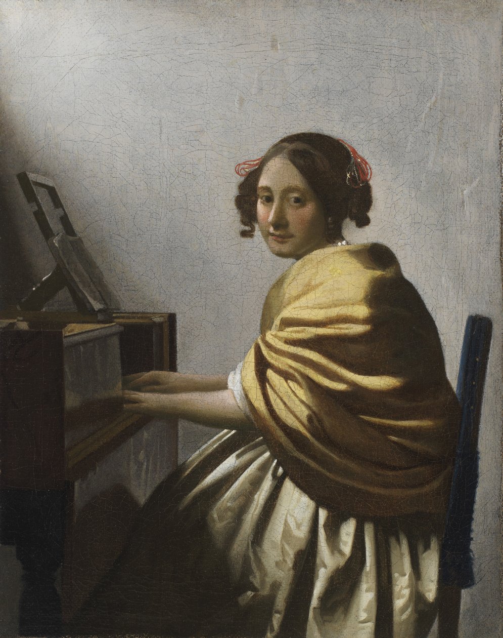 Młoda Kobieta siedząca w Virginal, ok. 1930 r. 1670 autorstwa Jan Vermeer van Delft