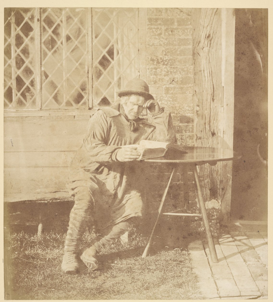 [Mężczyzna czytający książkę] autorstwa John Whistler