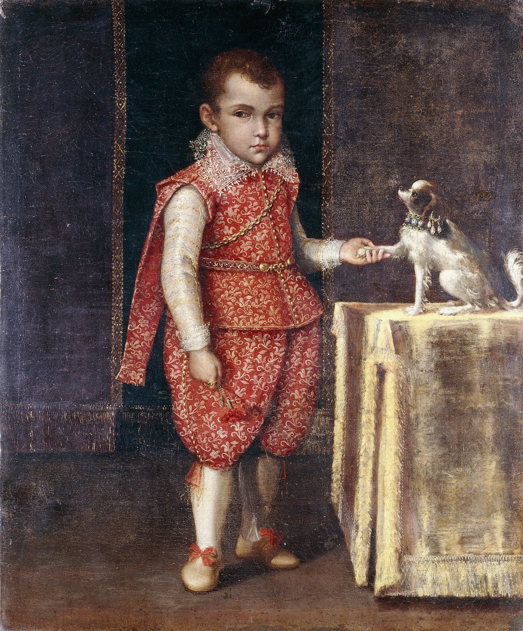 Portret Chłopca, pełnometrażowy, w czerwonym stroju haftowanym srebrem, trzymającego łapę spaniela na stole, autorstwa Lavinia Fontana