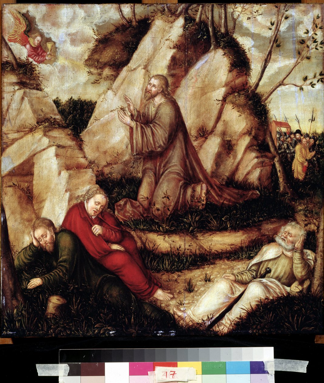 „Modlitwa w Ogrodzie Oliwnym” (Agonia w Ogrodzie) Po ostatniej wieczerzy Chrystus udaje się na wzgórze Getsemane, które z apostołami góruje nad Jerozolimą. Żołnierze rzymscy podchodzą do Judasza, by go aresztować. Malowanie na drewnie od L autorstwa Lucas the Elder Cranach