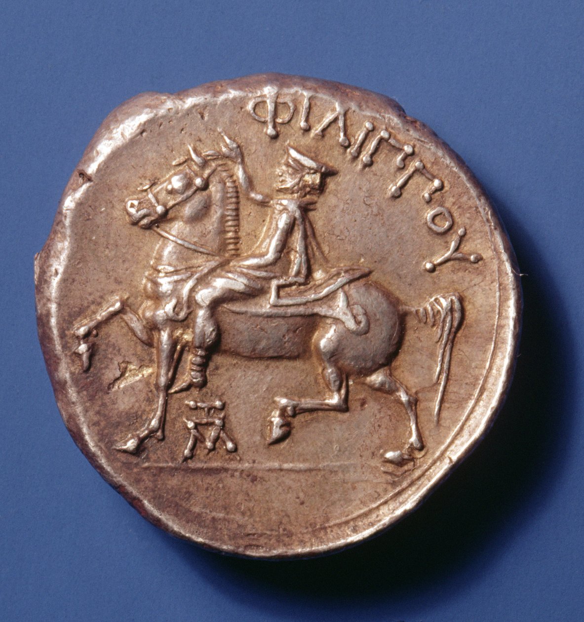 Srebrna moneta Filipa II Macedońskiego (359-336 pne) przedstawiająca jeźdźca jadącego w lewo. autorstwa Macedonian School