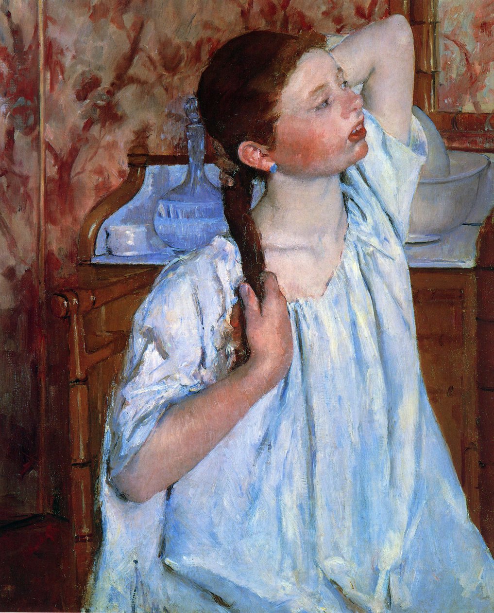 Dziewczyna układa włosy autorstwa Mary Cassatt