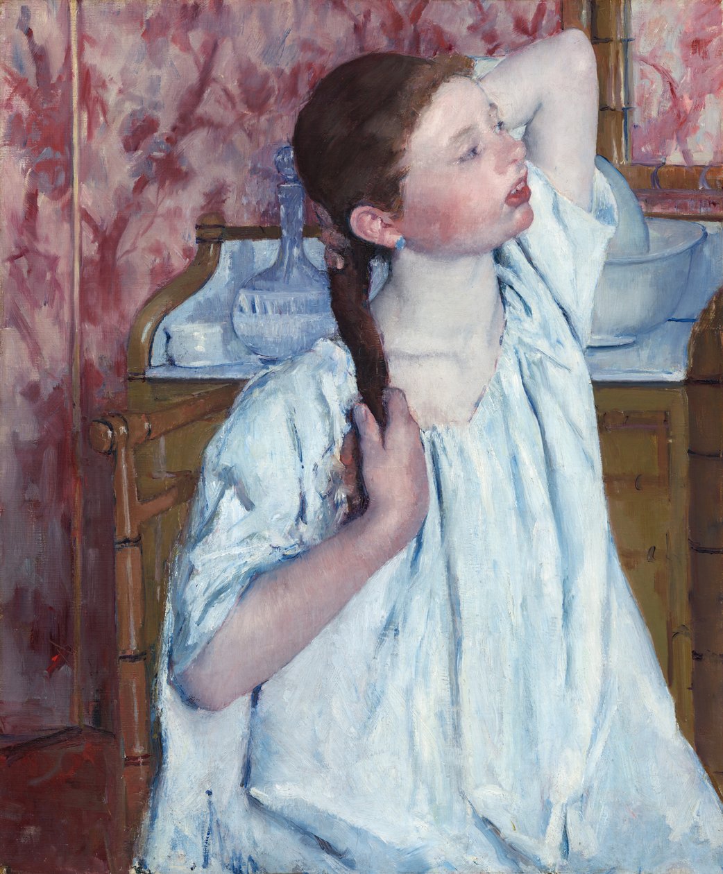 Dziewczyna układa włosy autorstwa Mary Cassatt