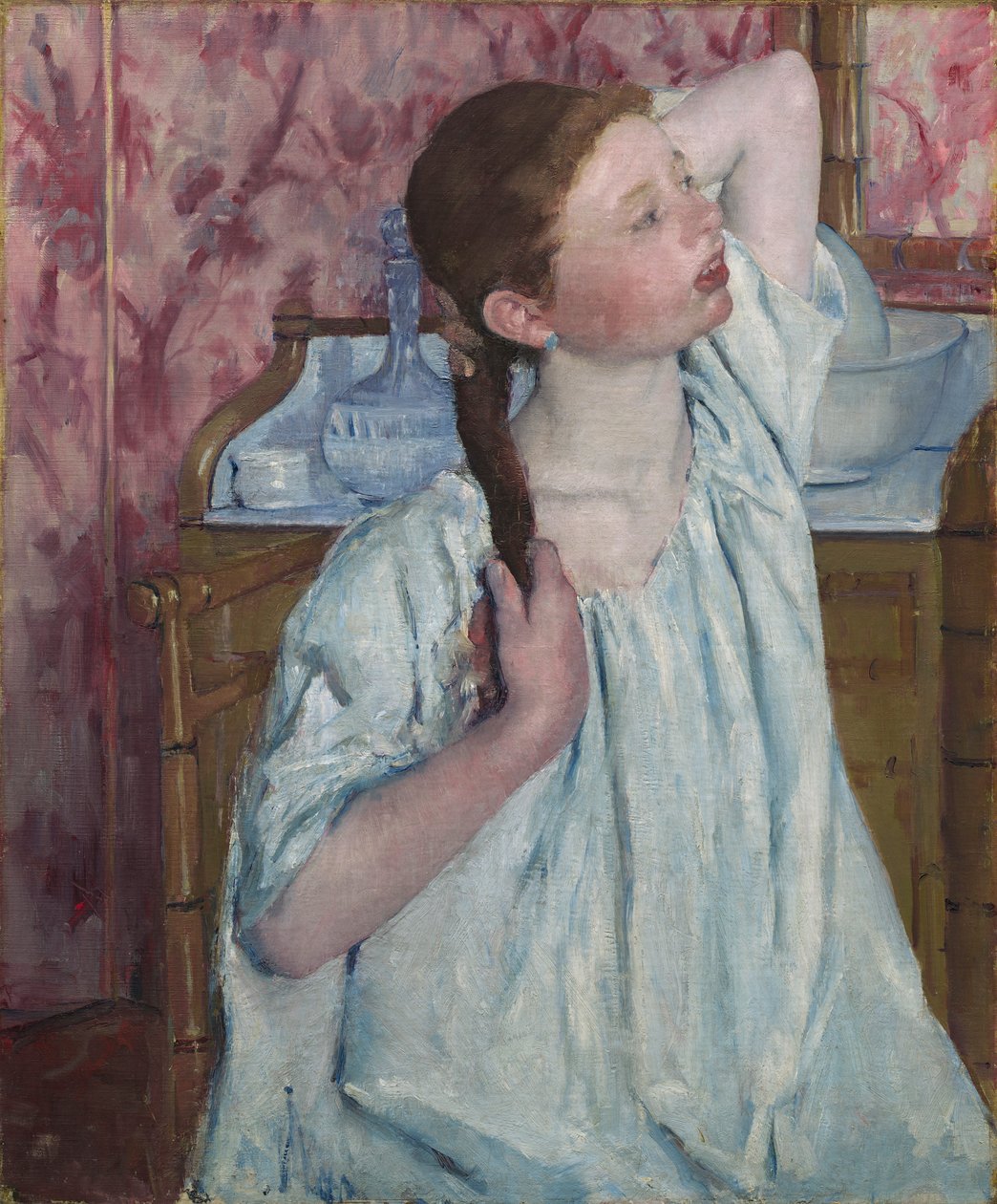 Dziewczyna układa włosy autorstwa Mary Stevenson Cassatt