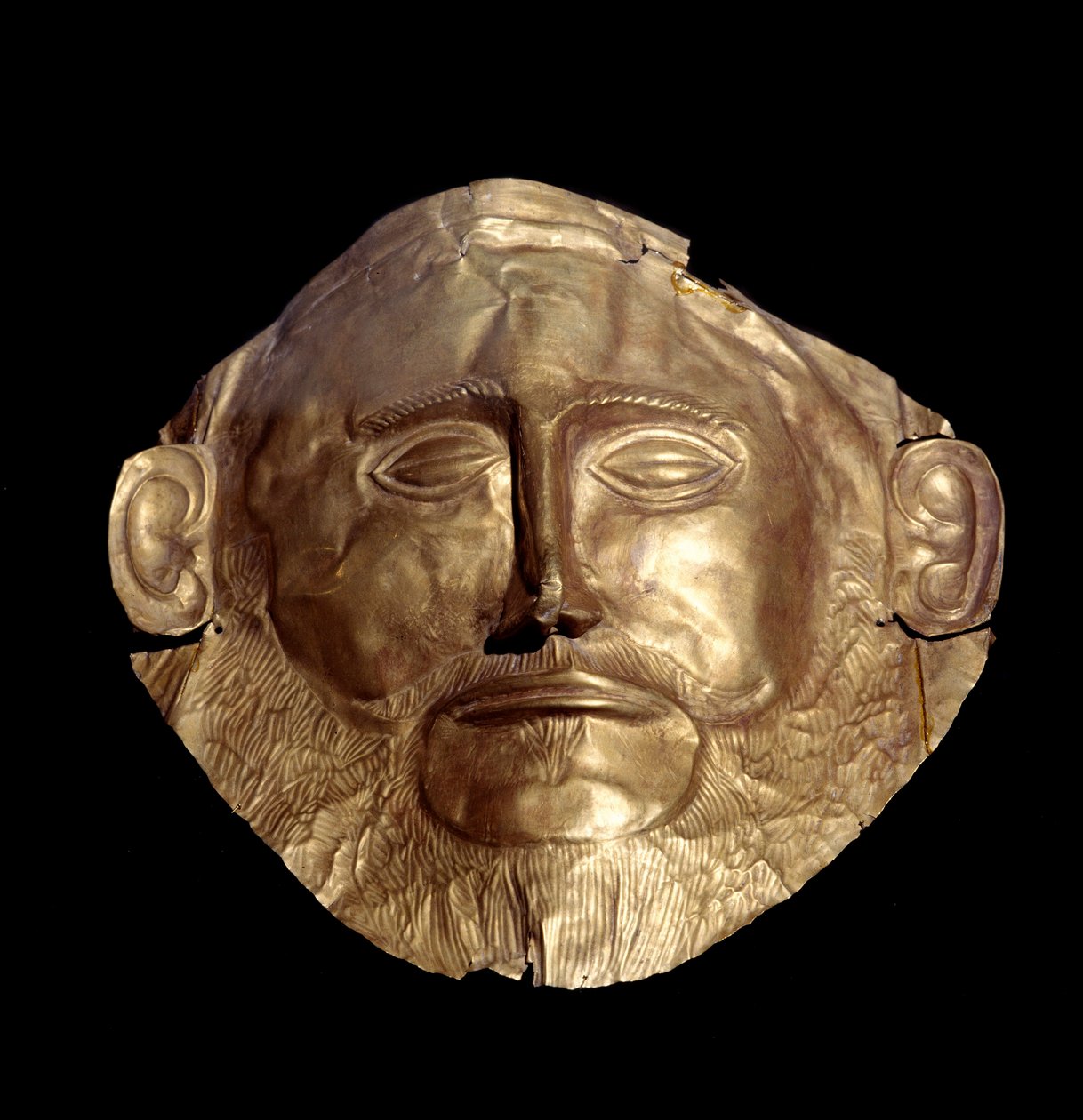 Maska pogrzebowa ze złota mykeńskiego (z Mycen) znana jako „Maska Agamemnona”” autorstwa Mycenaean