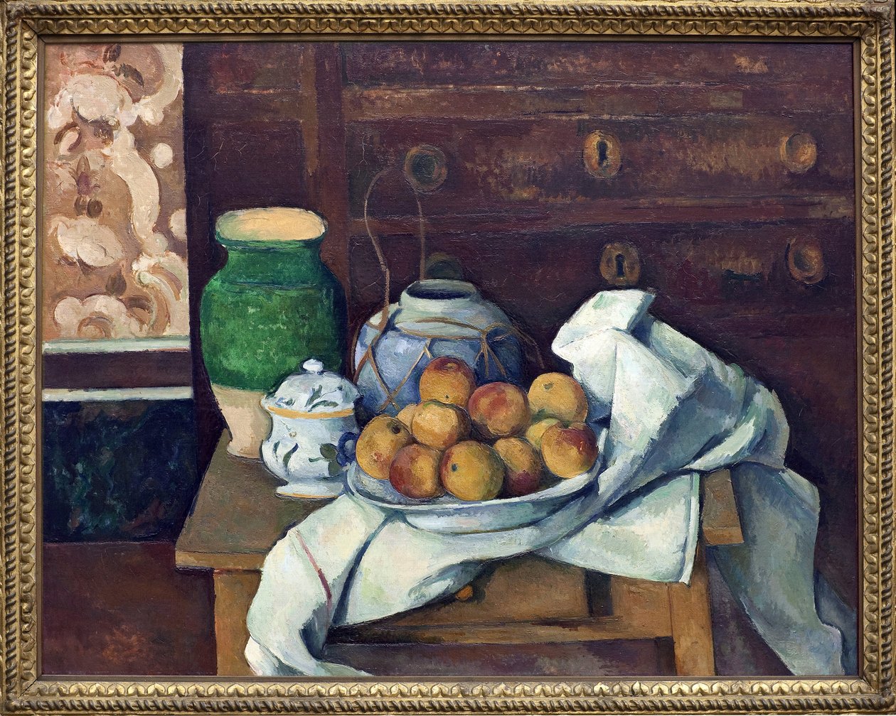 Martwa natura ma komodę. Obraz Paula Cezanne