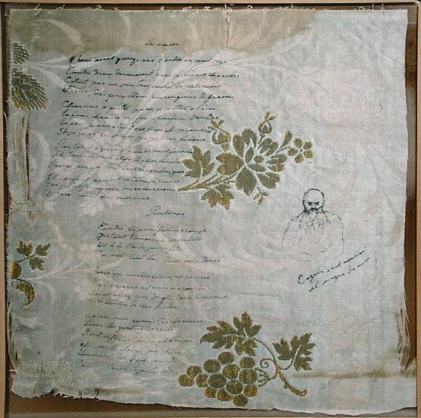 Kawałek obrusu, na którym Verlaine napisał swoje wiersze „Les Amies” i „Le Printemps”, z portretem Verlaine autorstwa Cazalsa (pióro i atrament na tkaninie) autorstwa Paul Verlaine