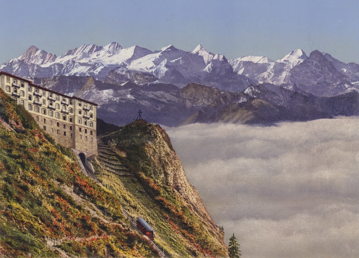 Kolejka linowa Stanserhorn 1900 m i hotel z Alpami Berneńskimi (zdjęcie kolorowe) autorstwa Photographer Swiss