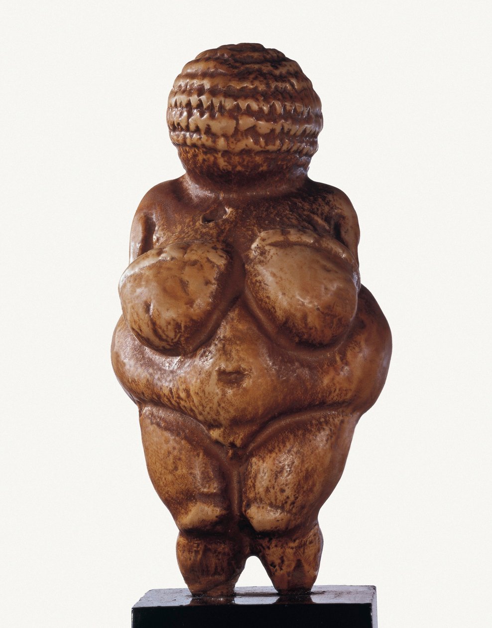 Wenus z Willendorfu. Statuetka z wapienia przedstawiająca kobietę o bardzo rozwiniętych formach. 23000 pne (wapień) autorstwa Prehistoric Prehistoric