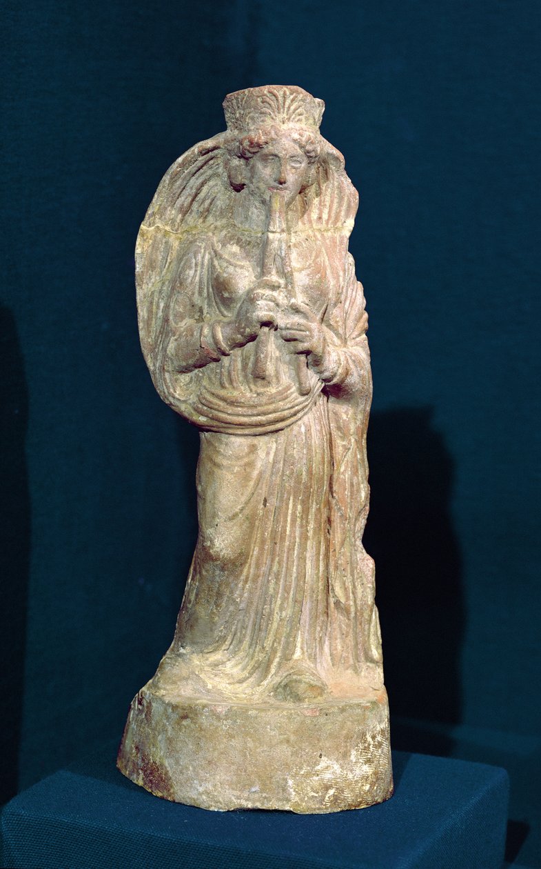 Statuetka kobiety grającej na podwójnym flecie, z Tunezji (kamień polichromowany) autorstwa Punic