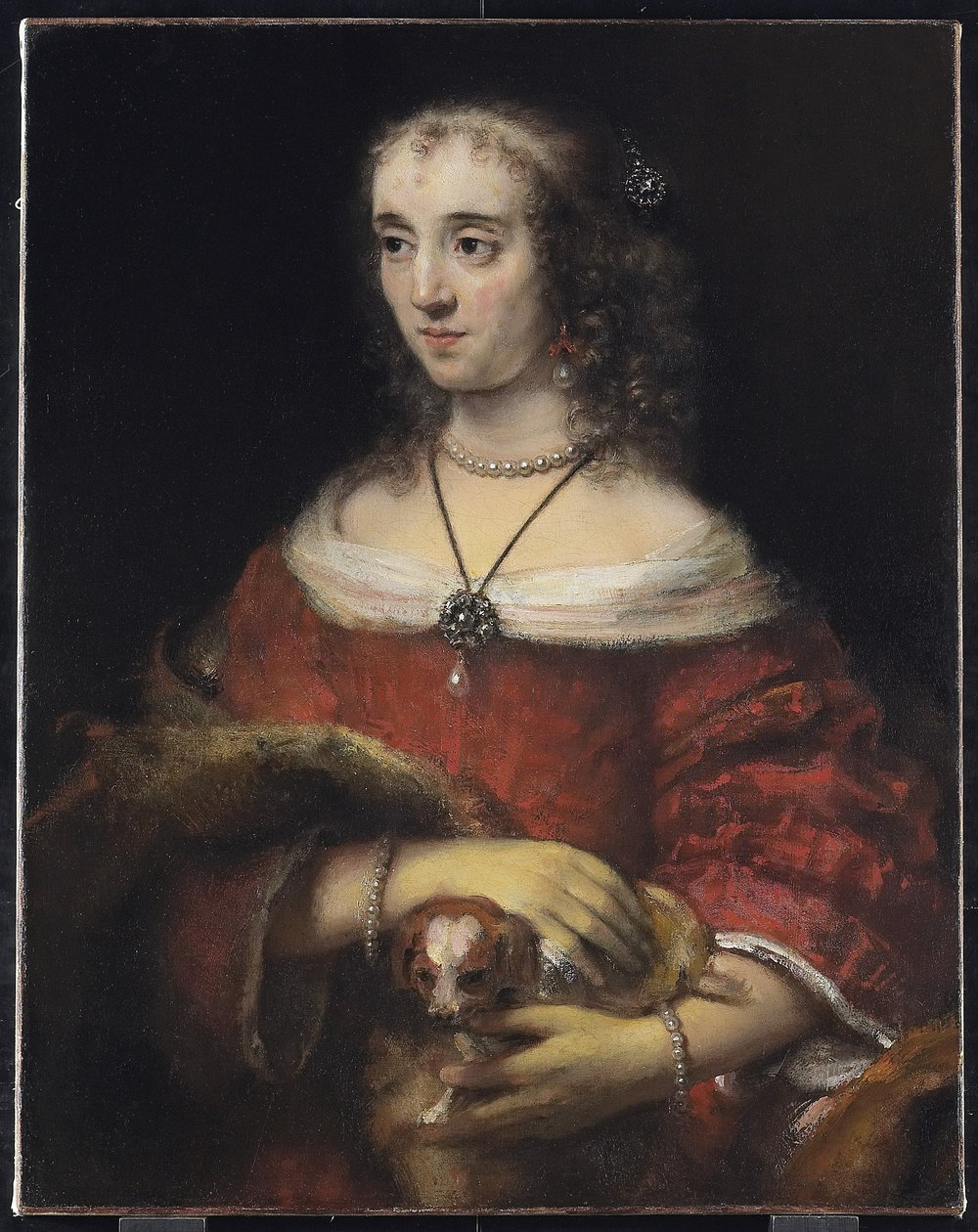 Portret damy z psem na kolanach, ok. 1665 autorstwa Rembrandt van Rijn