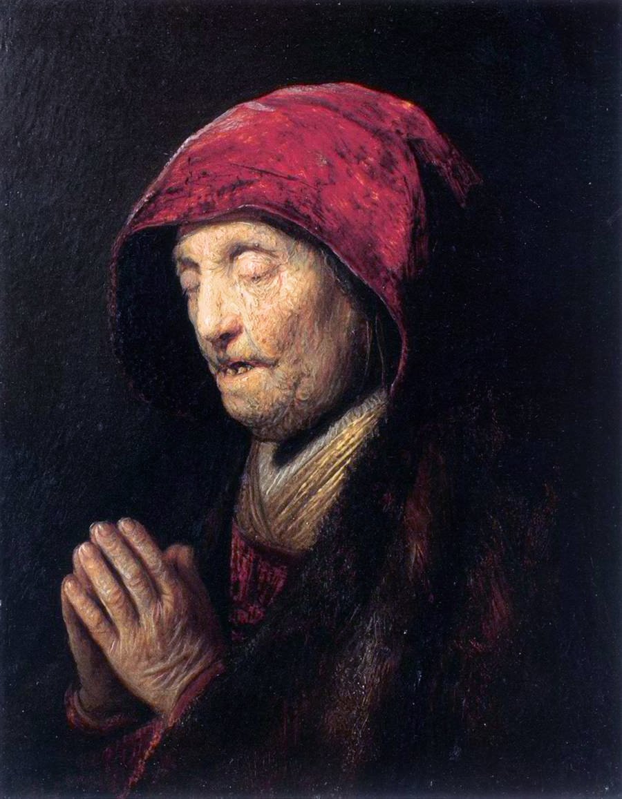 Stara kobieta się modli autorstwa Rembrandt van Rijn