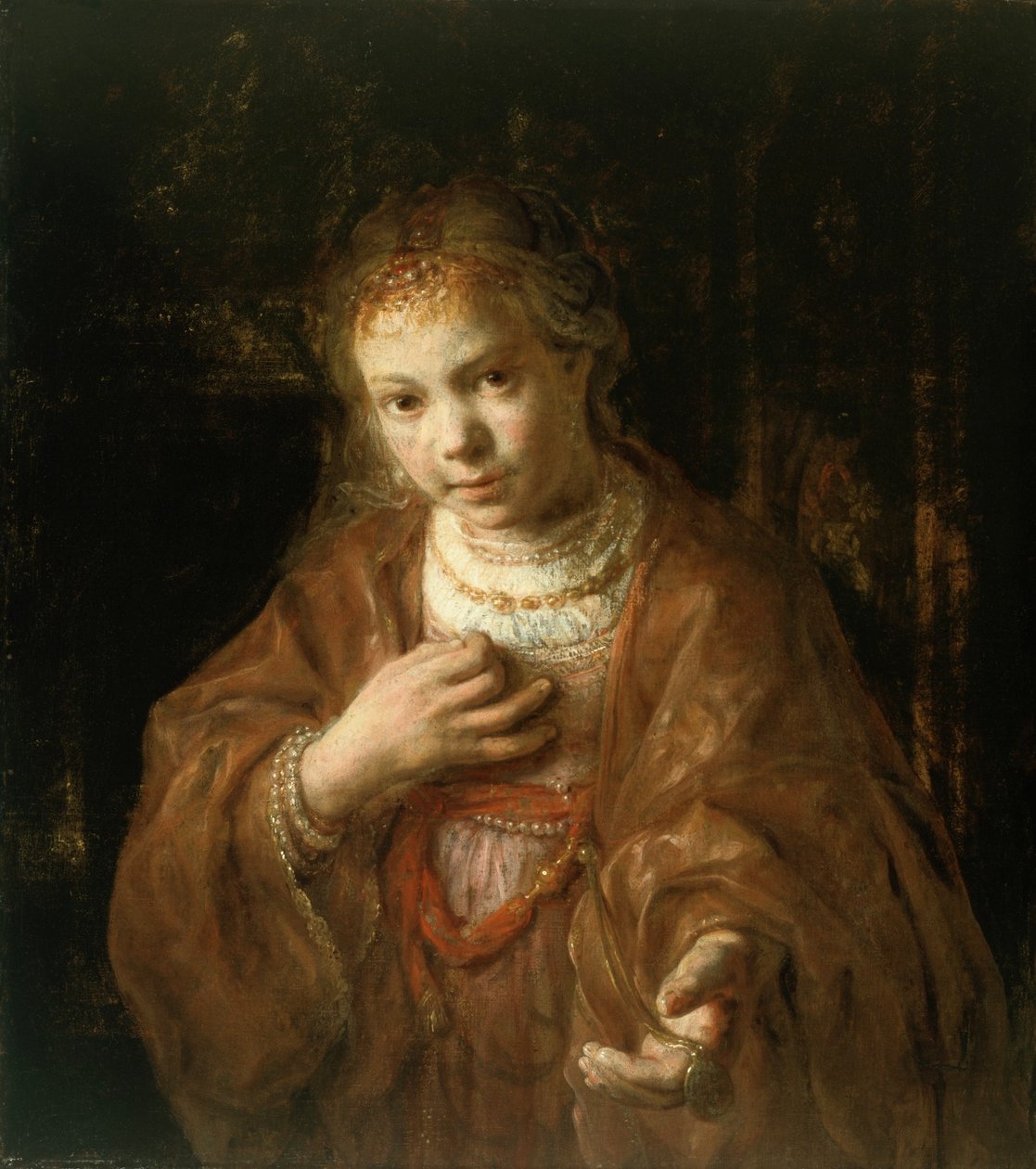 Młoda dziewczyna trzymająca medal autorstwa Rembrandt