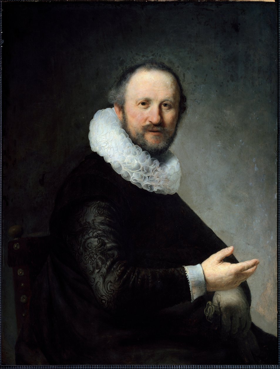 Holenderski burżuj trzymający rękawiczki, ubrany w kryzę. (Obraz autorstwa Rembrandt van Rijn
