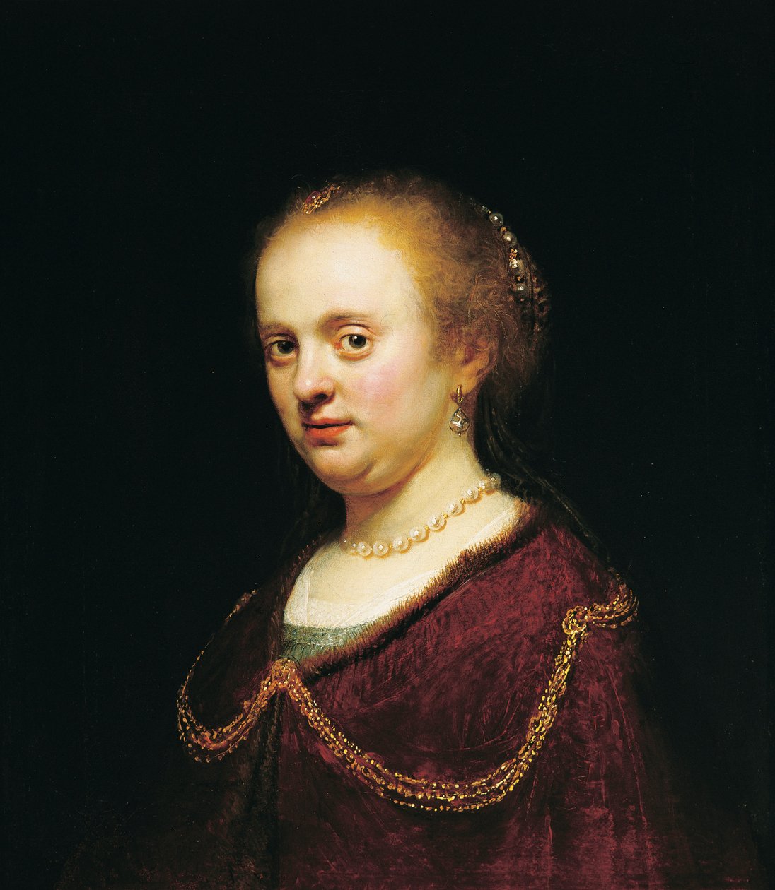Młoda kobieta ze złotym łańcuszkiem autorstwa Rembrandt Harmensz. van Rijn