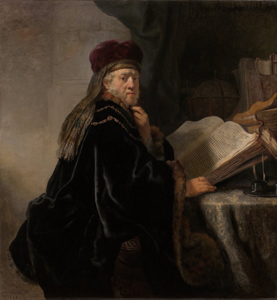 Uczony siedzący przy biurku Uczony w swoim gabinecie autorstwa Rembrandt van Rijn