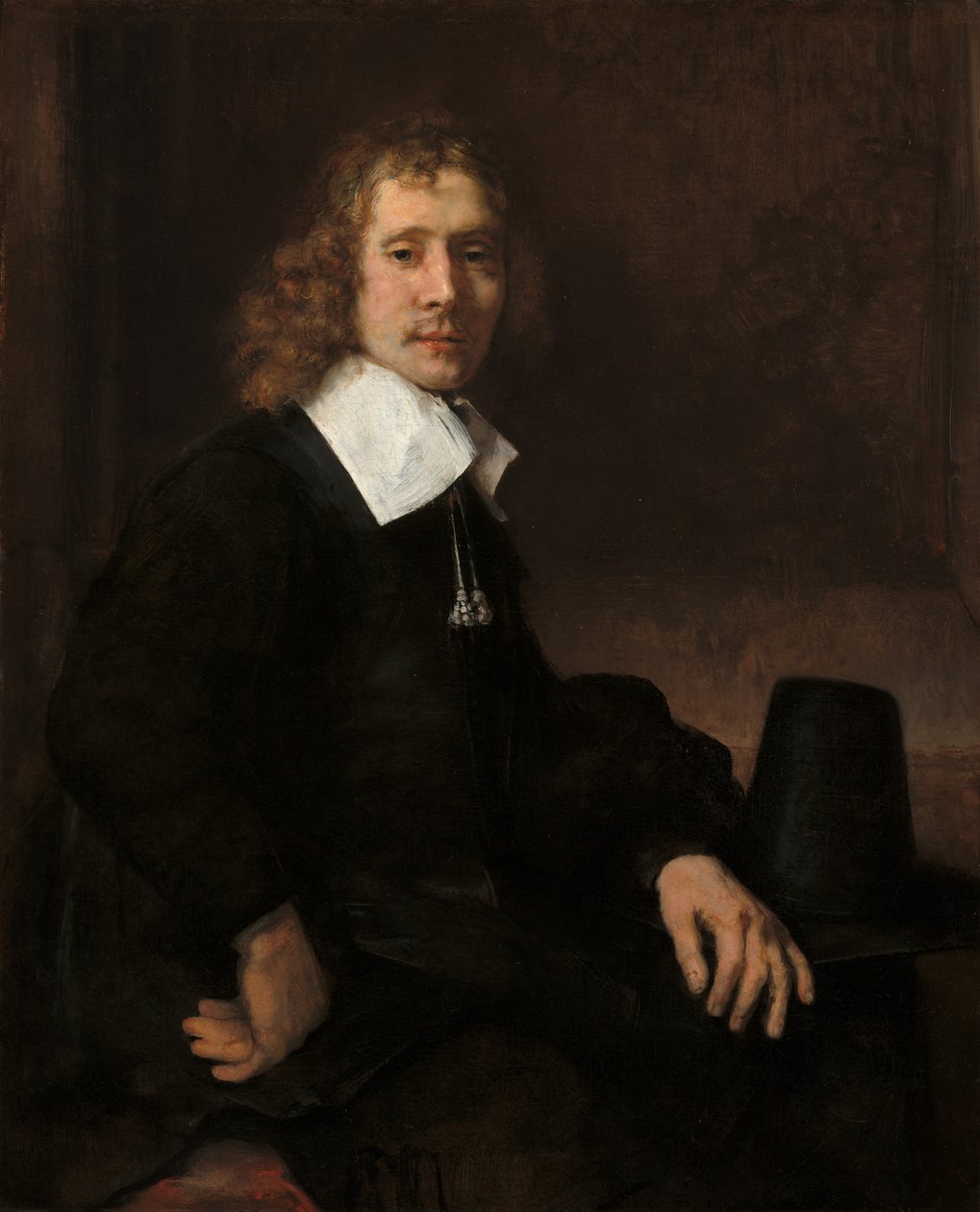 Młody mężczyzna siedzący przy stole, prawdopodobnie Govaert Flinck, ok. 1930 r. 1660. autorstwa Rembrandt van Rijn