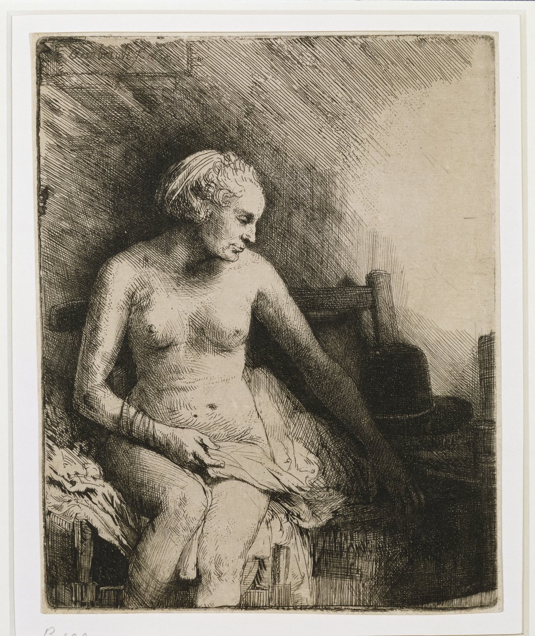 Kobieta w wannie z kapeluszem obok siebie, 1658 autorstwa Rembrandt van Rijn