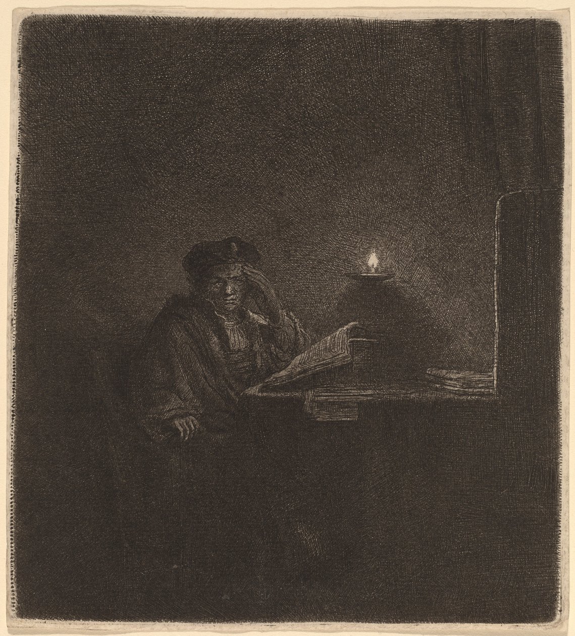 Uczeń przy stole przy świecach autorstwa Rembrandt van Rijn
