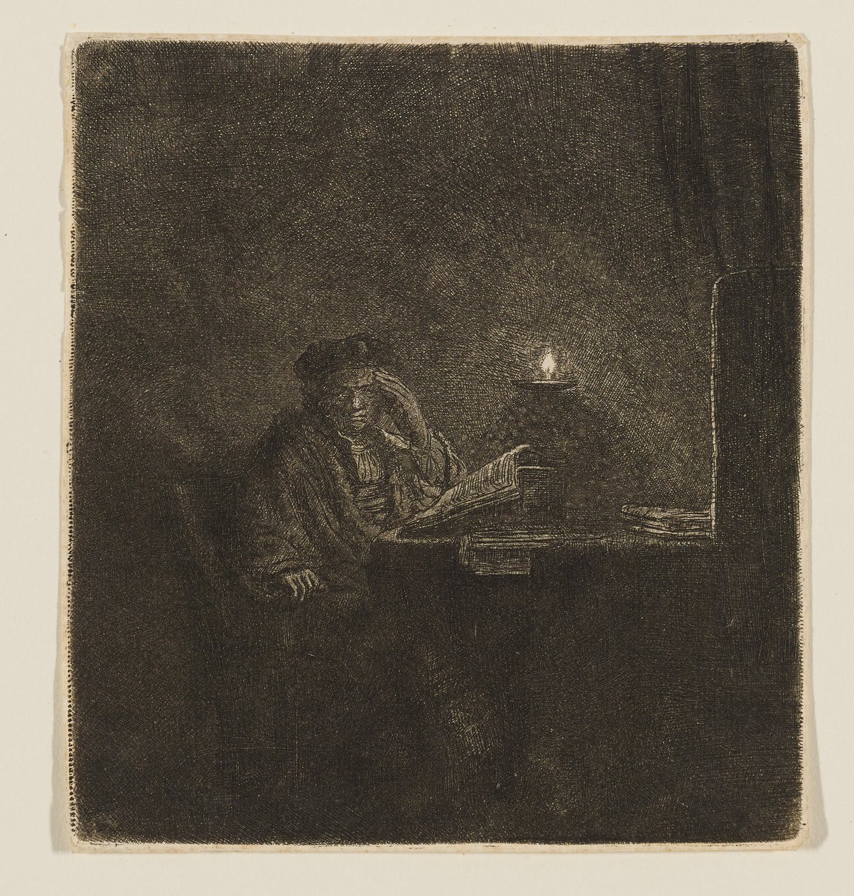 Student przy stole przy blasku świec autorstwa Rembrandt van Rijn