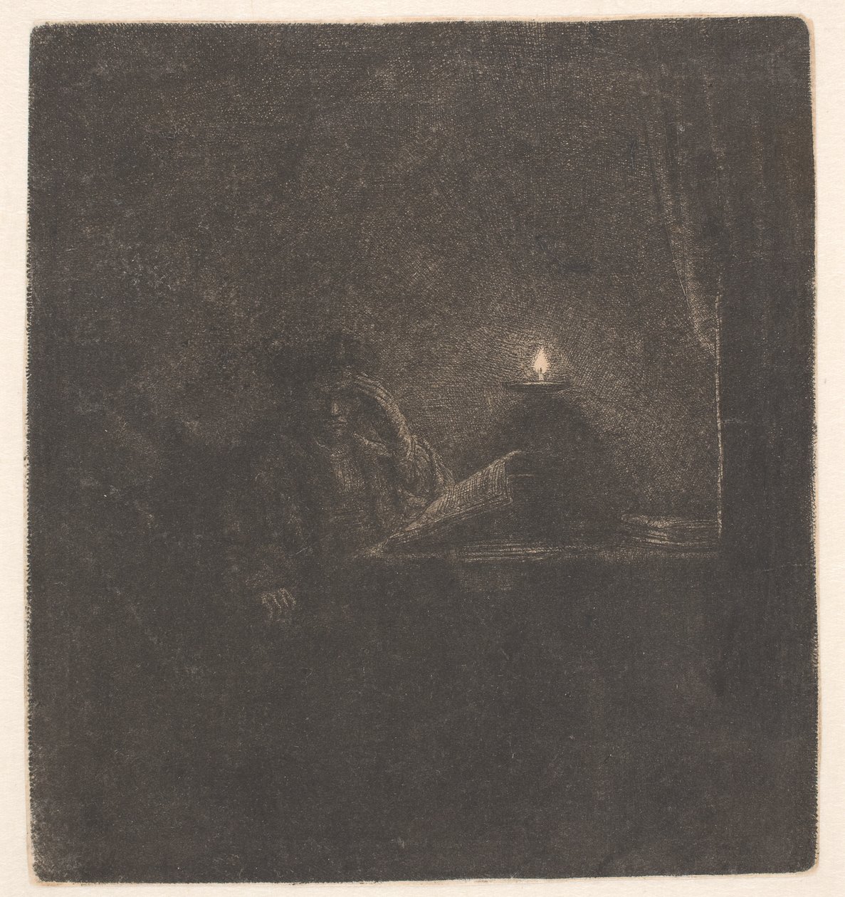 Student przy stole przy blasku świecy autorstwa Rembrandt van Rijn