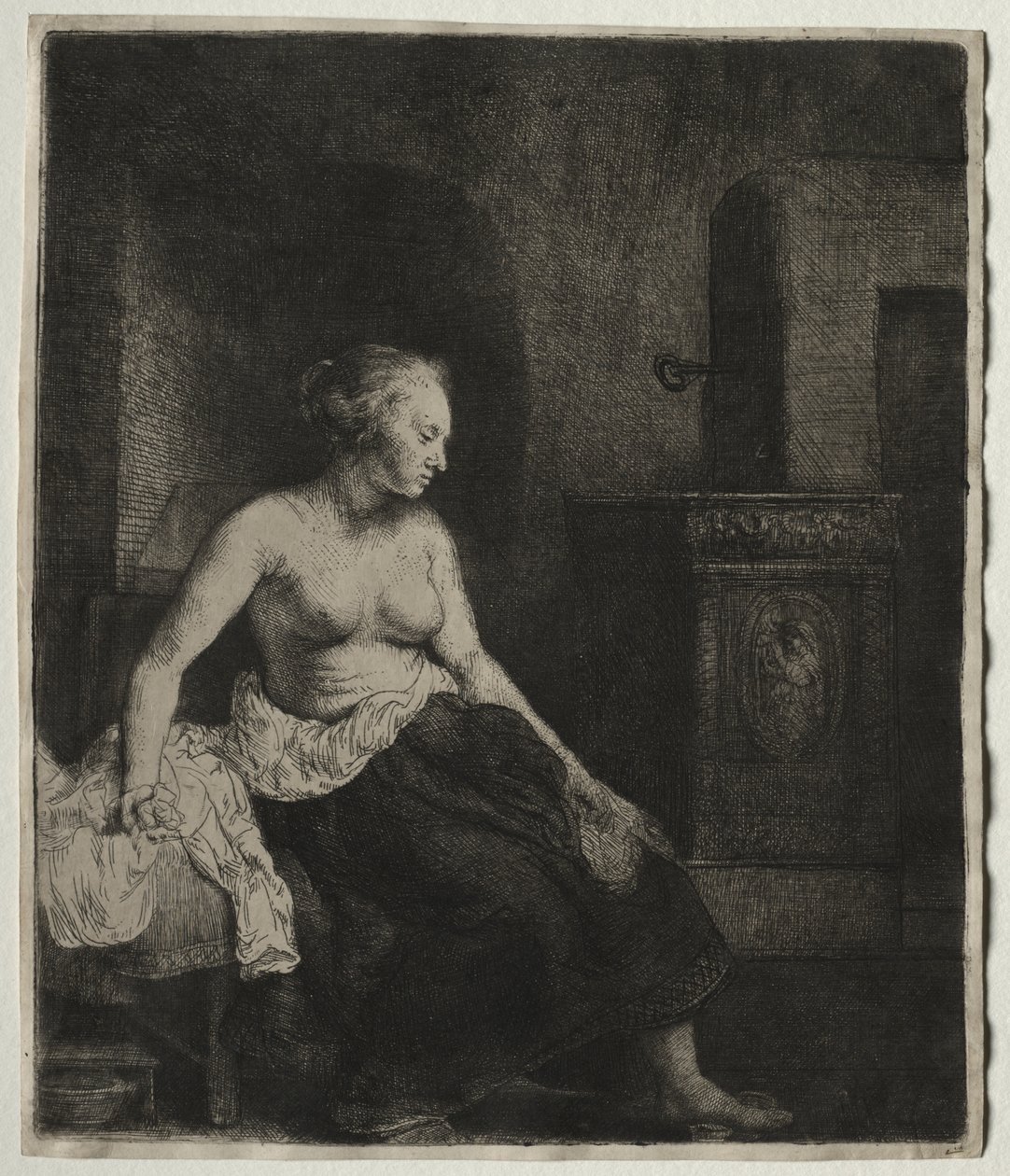 Kobieta siedząca do połowy ubrana przy piecu autorstwa Rembrandt van Rijn