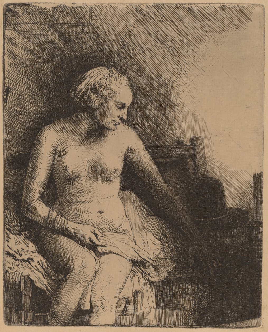 Kobieta w wannie z kapeluszem obok niej autorstwa Rembrandt van Rijn