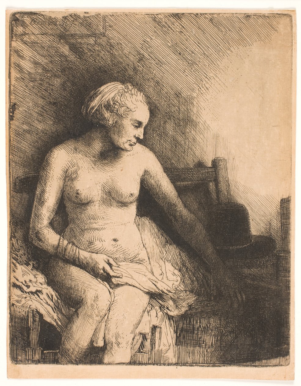 Kobieta w wannie, z kapeluszem obok niej autorstwa Rembrandt van Rijn