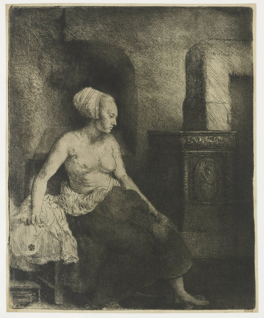 Kobieta siedzi na wpół ubrana obok pieca autorstwa Rembrandt van Rijn