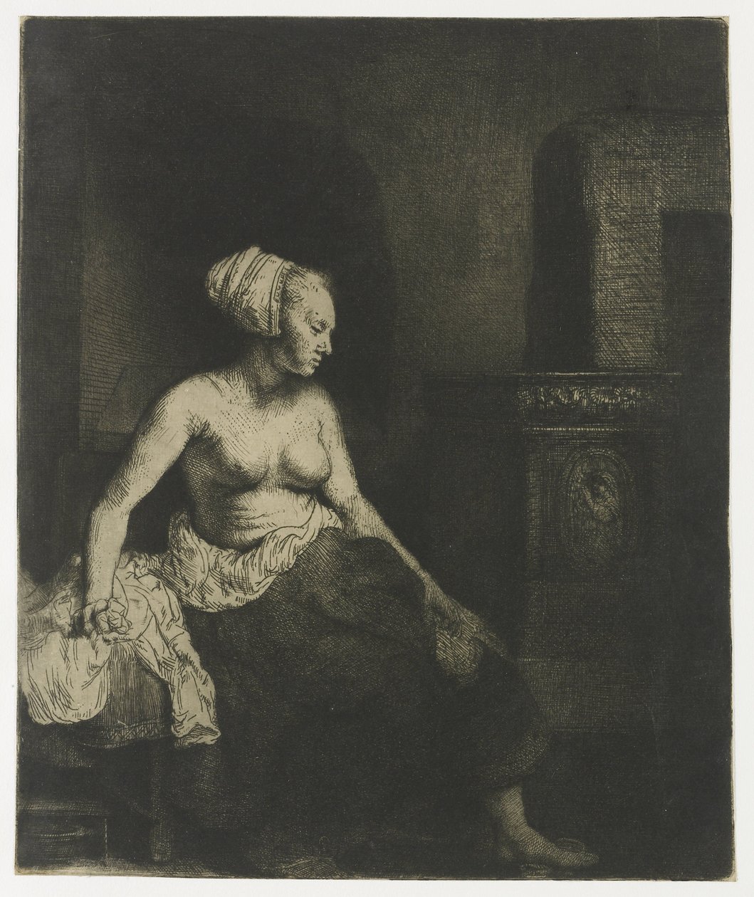 Kobieta siedzi na wpół ubrana obok pieca autorstwa Rembrandt van Rijn